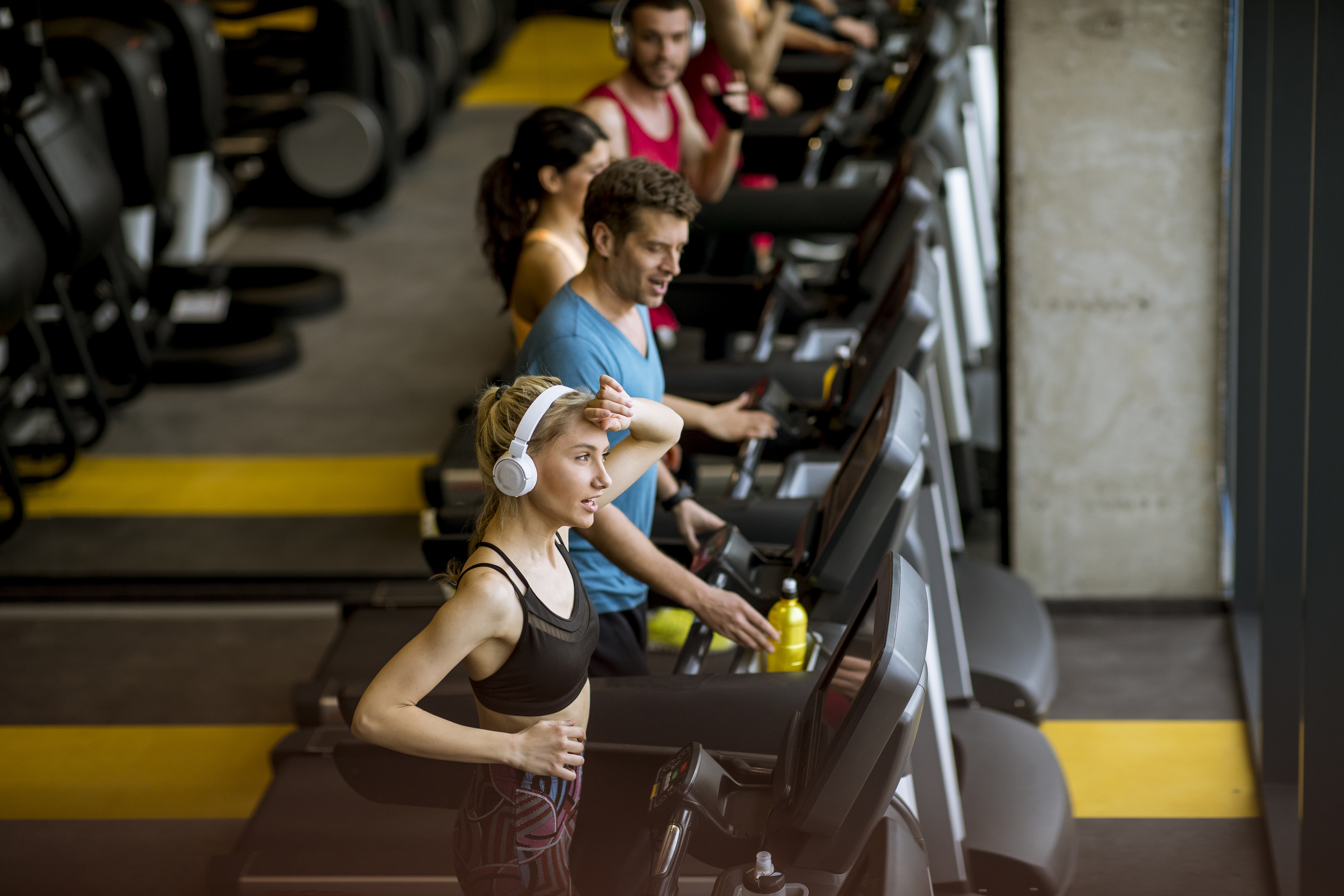 top-view-at-young-people-running-on-treadmills.jpg